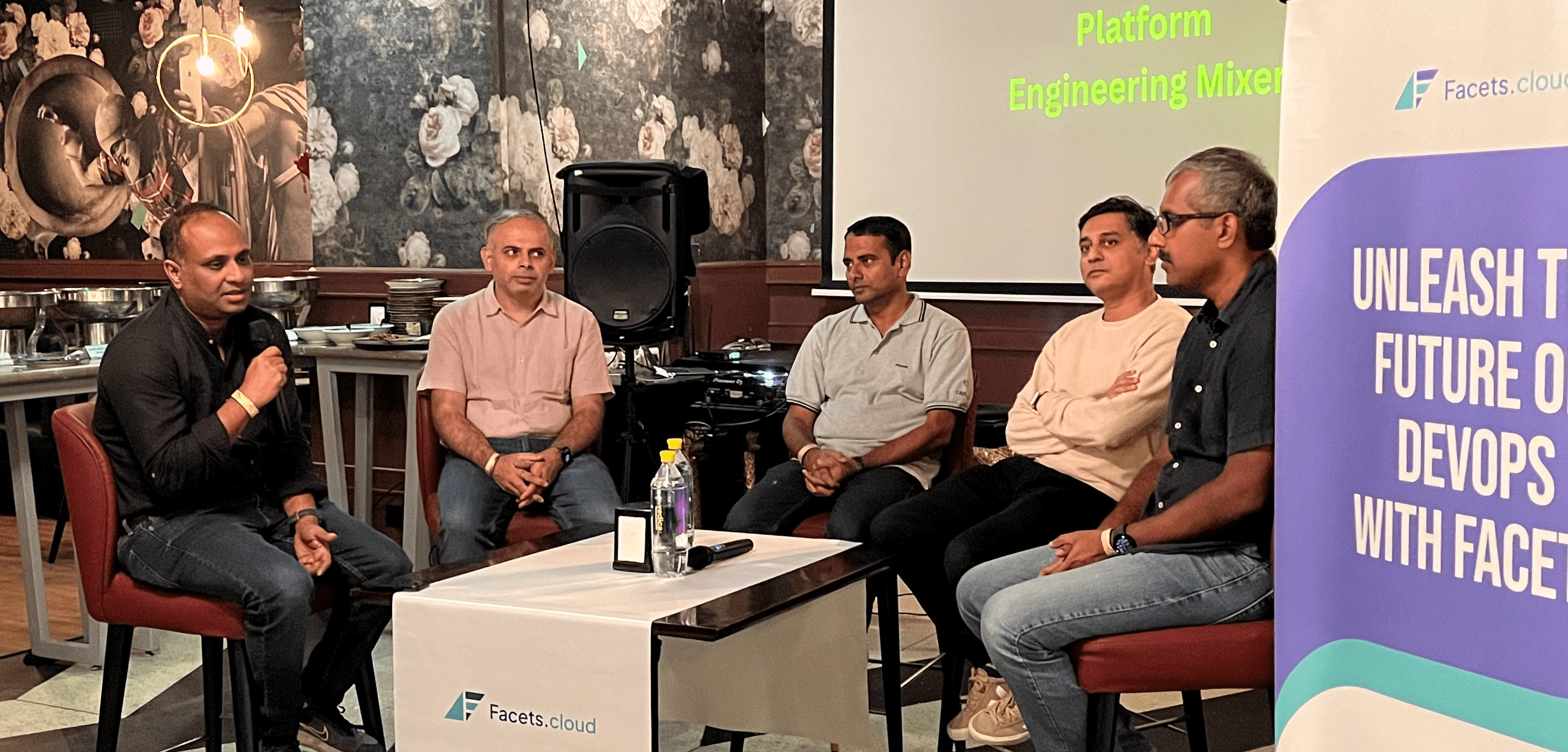 DevOps thought leaders on one stage discussing all things platform engineering